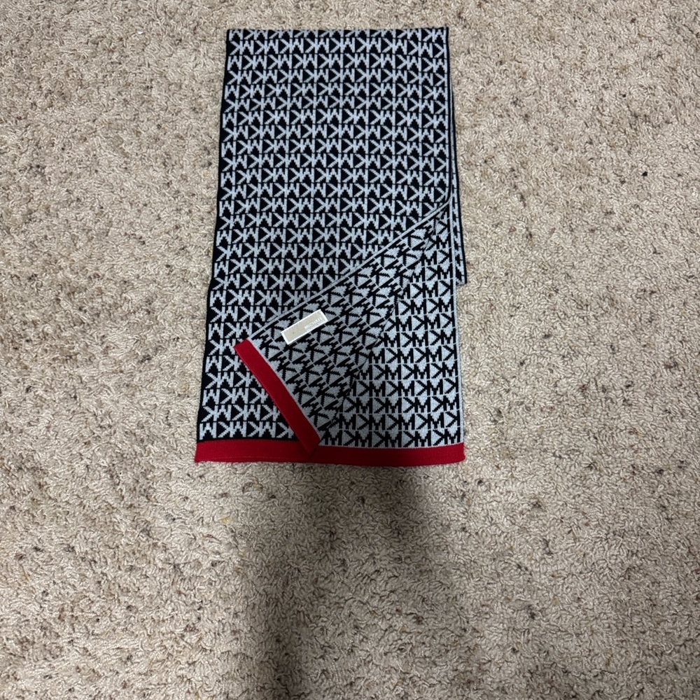Michael Kors Stylish Black and White Patterned Scarf with Red Trim